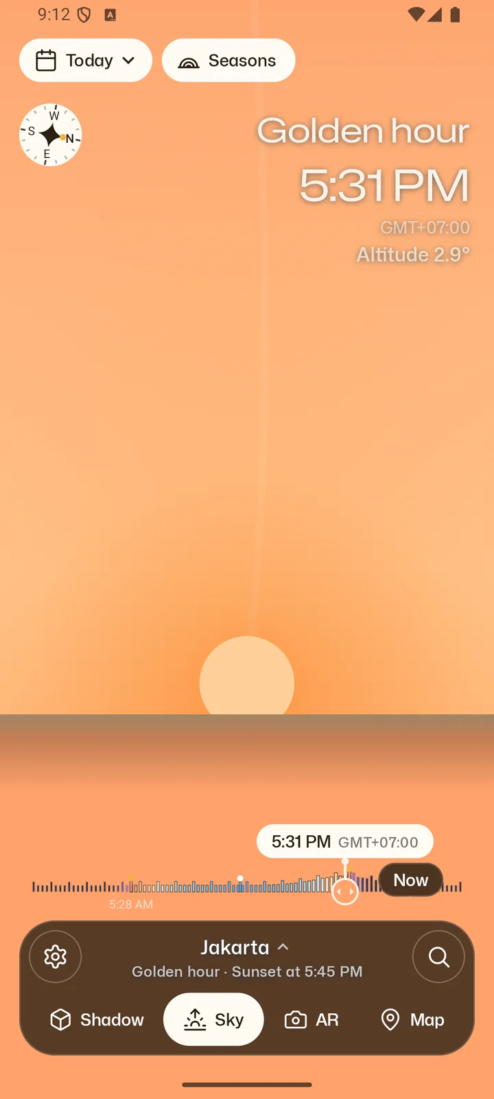 Senja's Sky view: the sun low over the horizon at golden hour, 5:31 PM in Jakarta.